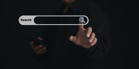 Concept Search engine for website : Businessman using finger on virtual screen for Search news , information , technology , data , media , stock etc 