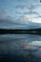Still Waters Of Laurel Lake Reflect The Morning Sky In Yosemite