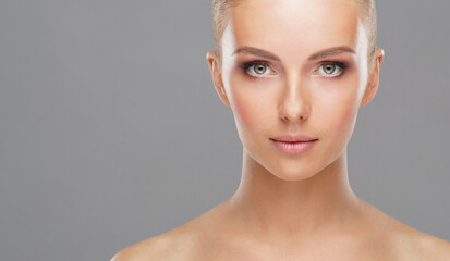 Beautiful face of young and healthy girl. Skin care, cosmetics and face lifting concept.