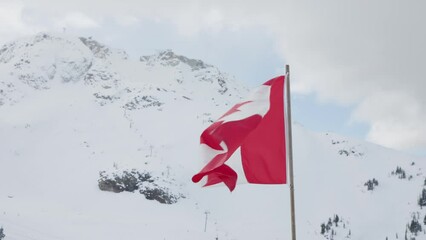 Canadian flag flying on top of Whistler Mountain, British Columbia, Canada.