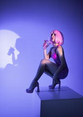 girl with pink hair in latex pink disco dress