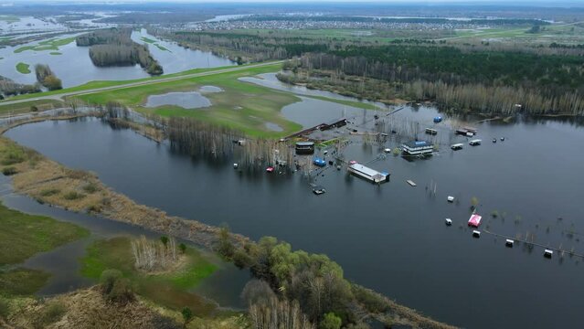 Aerial view. Flooded Small Town In Belarus,  Gomel. Houses are overflowing with water.