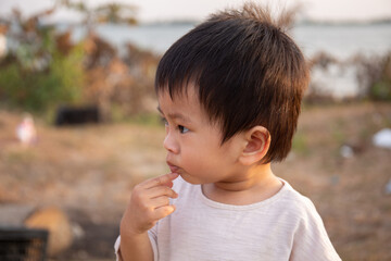 Portrait of Asian kid in the sunset