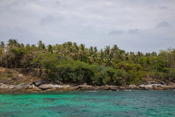Beautiful jungle islands. Rain clouds. Rainy day in thailand. Beautiful sea. Palm trees on the islands. Cloudy sky.