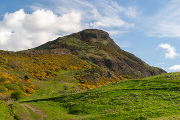 Fototapeta na wymiar Arthur Seat, Edinburgh, Scotland. The extinct volcano at Salisbury crags dominates the city skyline
