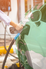 handhold electric charger.alternative energy concept.Close up of the Hybrid car electric charger...