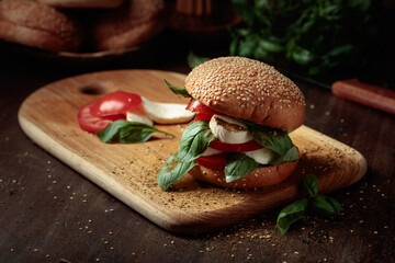 Sandwich with mozzarella, tomatoes, and basil.