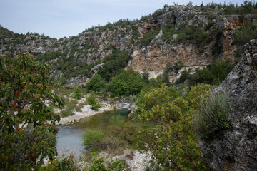 Fototapeta na wymiar A river runs through the mountains in the distance.