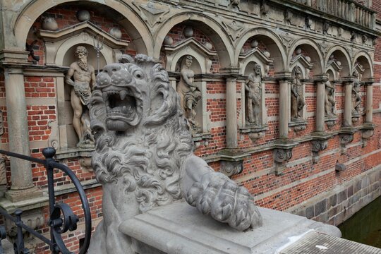 Sculpture of a lion and other pieces on the facade of the Frederiksborg castle, Hilerod, Denmark