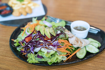 fresh vegetable salad of tomato, kiwi fruit and chicken meat breast