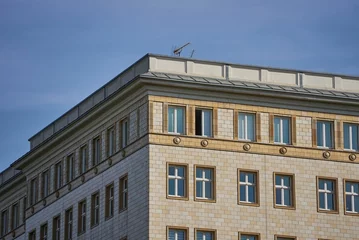 Foto op Plexiglas Centraal Europa Closeup shot of modern unique buildings in Berlin, Germany with blue sky in the background