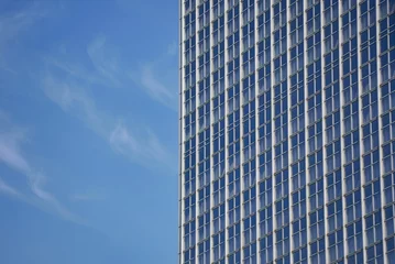 Foto op Plexiglas Centraal Europa Closeup shot of modern unique buildings in Berlin, Germany with blue sky in the background