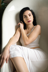 Fototapeta premium girl in clothes sit in the bath