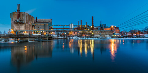 Panorama of Illuminated Factory Skyline at Dusk in Sweden