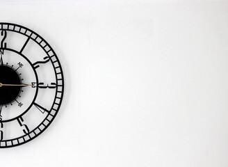 A half of the wall clock placed in the left side of the background to create a black and white...