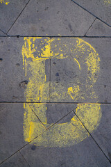 Paris - 08-23-2019: letter b painted on the sidewalk