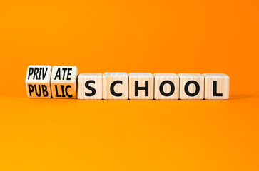 Public or private school symbol. Concept word Public school Private school on wooden cubes. Beautiful orange background. Education Public or private school concept. Copy space.