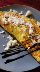 chicken egg omelet with vegetables and meat with pomegranate sauce, health and food, tourism