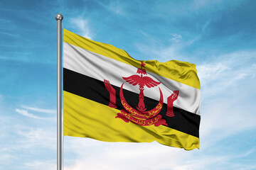 Brunei national flag cloth fabric waving on beautiful sky Background.