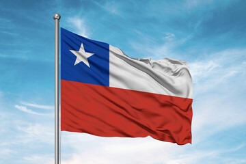 Fototapeta na wymiar Chile national flag cloth fabric waving on beautiful sky Background.