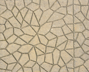 Background texture, pavers on sidewalk surface, closeup of the pattern on concrete or cement exterior tile. Irregular geometric flagstone design on paving slabs or blocks. Non-slip relief floor.