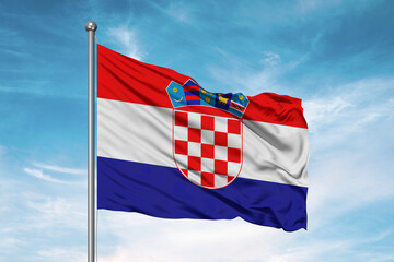 Croatia national flag cloth fabric waving on beautiful sky Background.