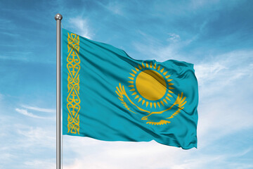 Kazakhstan national flag cloth fabric waving on beautiful sky Background.