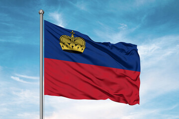 Naklejka na ściany i meble Liechtenstein national flag cloth fabric waving on beautiful sky Background.