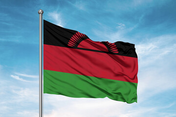 Fototapeta na wymiar Malawi national flag cloth fabric waving on beautiful sky Background.