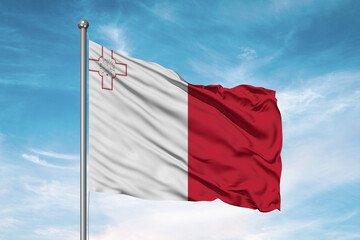 Malta national flag cloth fabric waving on beautiful sky Background.