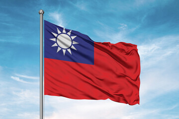 Fototapeta na wymiar Taiwan national flag cloth fabric waving on beautiful sky Background.