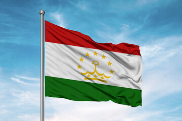 Naklejka na ściany i meble Tajikistan national flag cloth fabric waving on beautiful sky Background.