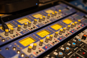 Amplifier levels on recording and mixing console in recording studio