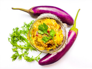 Roasted mashed eggplant or Begun bhorta.Roasted mashed eggplant is also known as Baigan Bharta or...