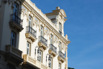 Classy retro facade with art deco elements downtown Madrid, Spain. Spanish classical architecture