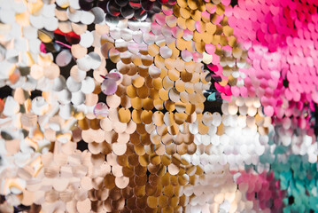 Background with colored glitters. Silver photo booth with decor shiny for party time. Zone with...