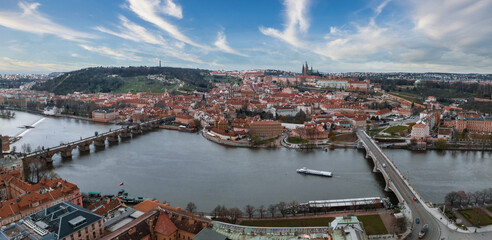 Obraz premium Scenic spring panoramic aerial view of the Old Town pier architecture and Charles Bridge over Vltava river in Prague, Czech Republic