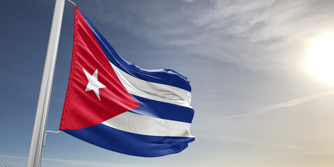 Cuba national flag cloth fabric waving on beautiful sky grey Background.