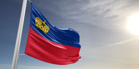 Liechtenstein national flag cloth fabric waving on beautiful sky grey Background.