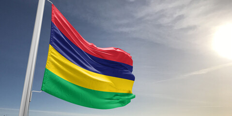 Mauritius national flag cloth fabric waving on beautiful sky grey Background.