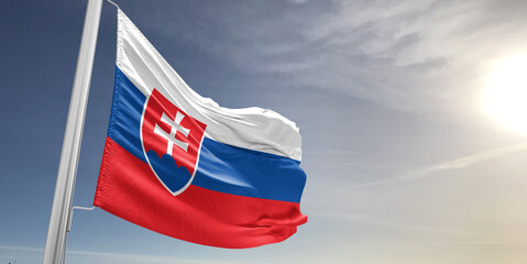 Slovakia national flag cloth fabric waving on beautiful sky grey Background.