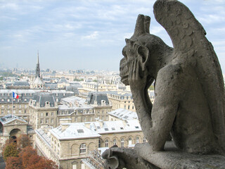 Paris, France - The legendary gargoyles of Notre-Dame-de-Paris, stone creatures intended to protect...