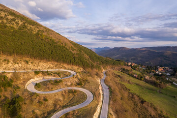 Aerial view of curvy road on monte Nerone slope in Marche region in Italy
