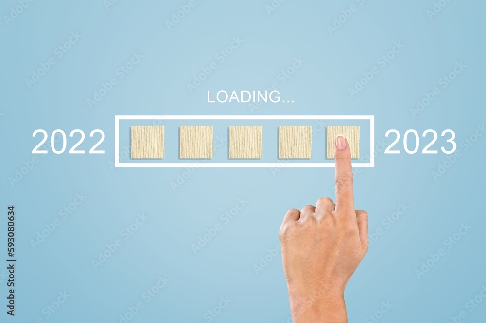 Poster Female hand on wooden cube Loading year