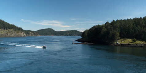 Motor boat following ferry to Swartz Bay near Moresby passage - 2