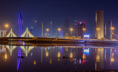 Fototapeta na wymiar Manama illuminated downtown on the shore of Persian gulf, Manama, Bahrain