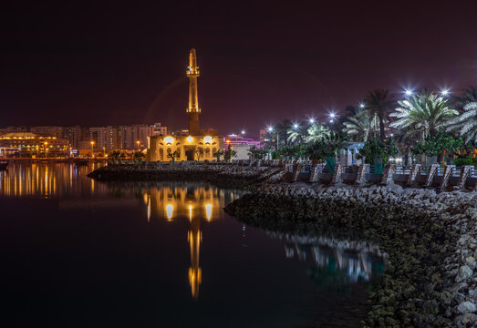 Hanan Kanoo Mosque in the evening lights on the shore of Persian Gulf, Manama, Bahrain
