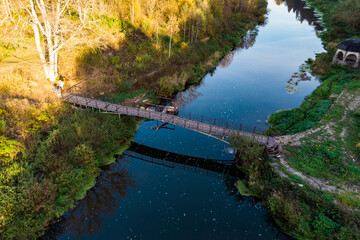 Fototapeta na wymiar Top view of the footbridge over a small river
