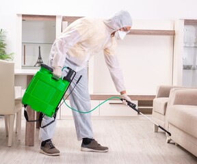 Pest control contractor working in the flat
