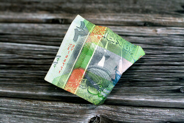 Selective focus of crumpled Kuwaiti money of Half KWD Kuwait dinar bill banknote isolated, wrinkled...